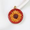 boucle d oreille fleur rouge jaune tournesol, tannage végétal, l'âge du cuir, maroquinerie artisanale éthique et responsable, dordogne, france